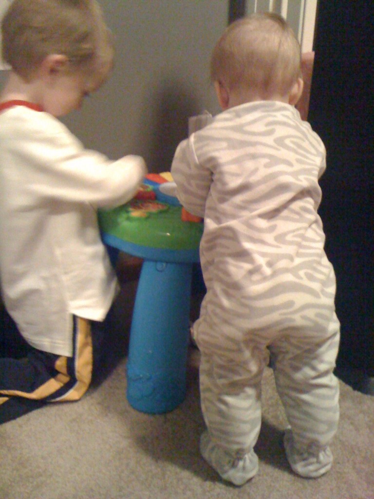 8 months old standing baby